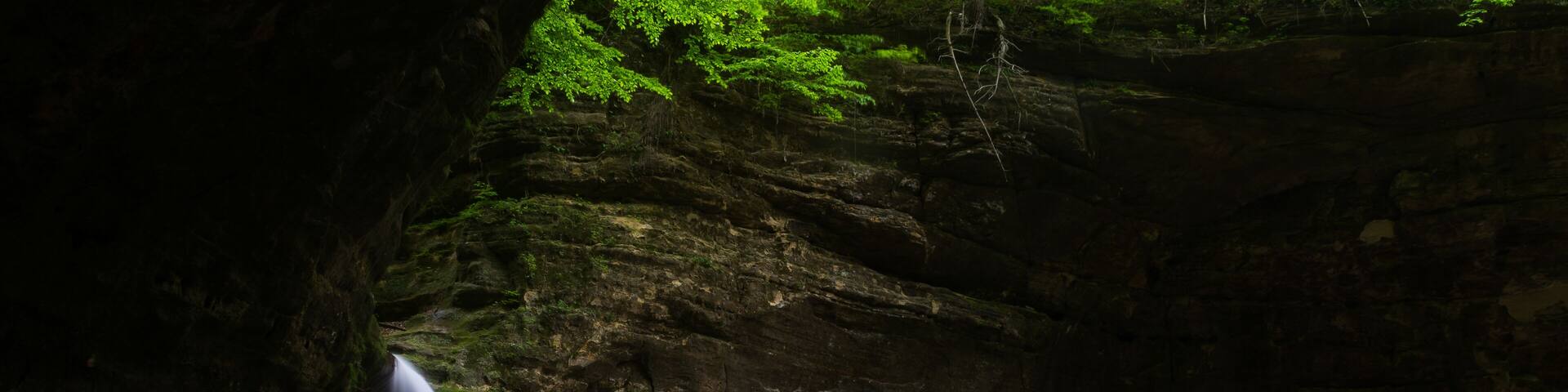 Sunlight shining on Cascade Falls on a Spring morning. Matthiessen State Park, Illinois, USA