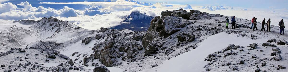 Climbers ascending the crater rim of Mt. Kilimanjaro, up from Stella Point, as seen from the summit area.