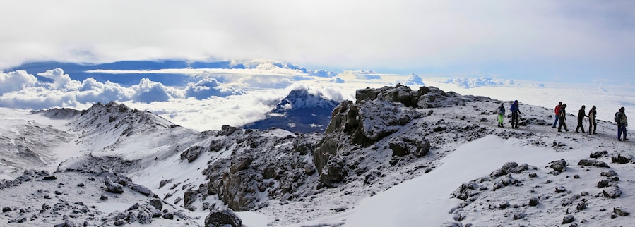 Climbers ascending the crater rim of Mt. Kilimanjaro, up from Stella Point, as seen from the summit area.