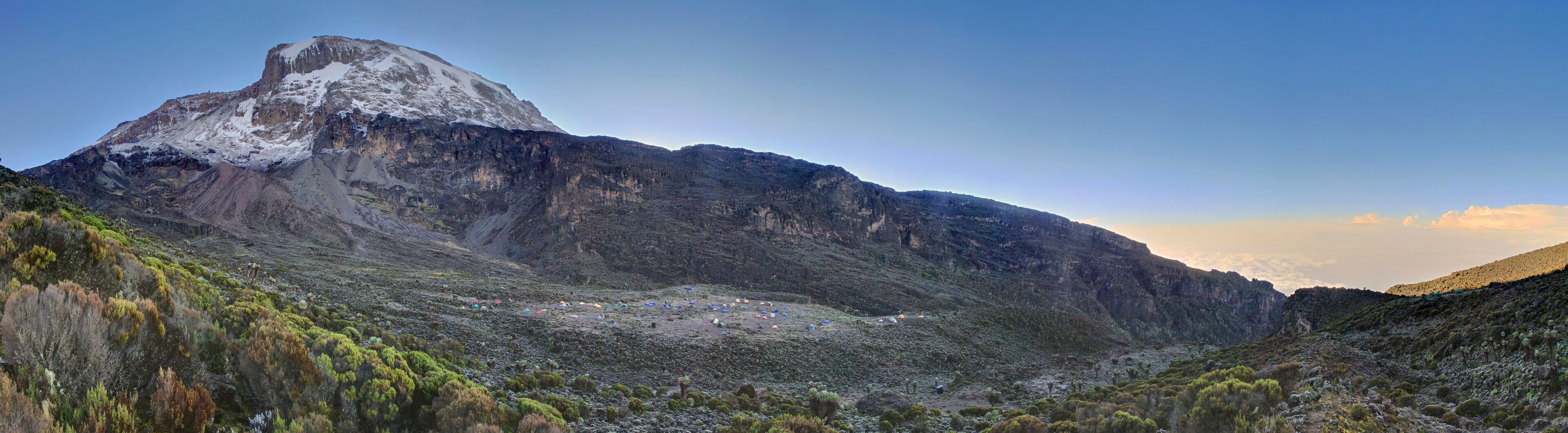 Barranco camp in front or Barranco Wall and Mt. Killimanjaro (HDR capture).