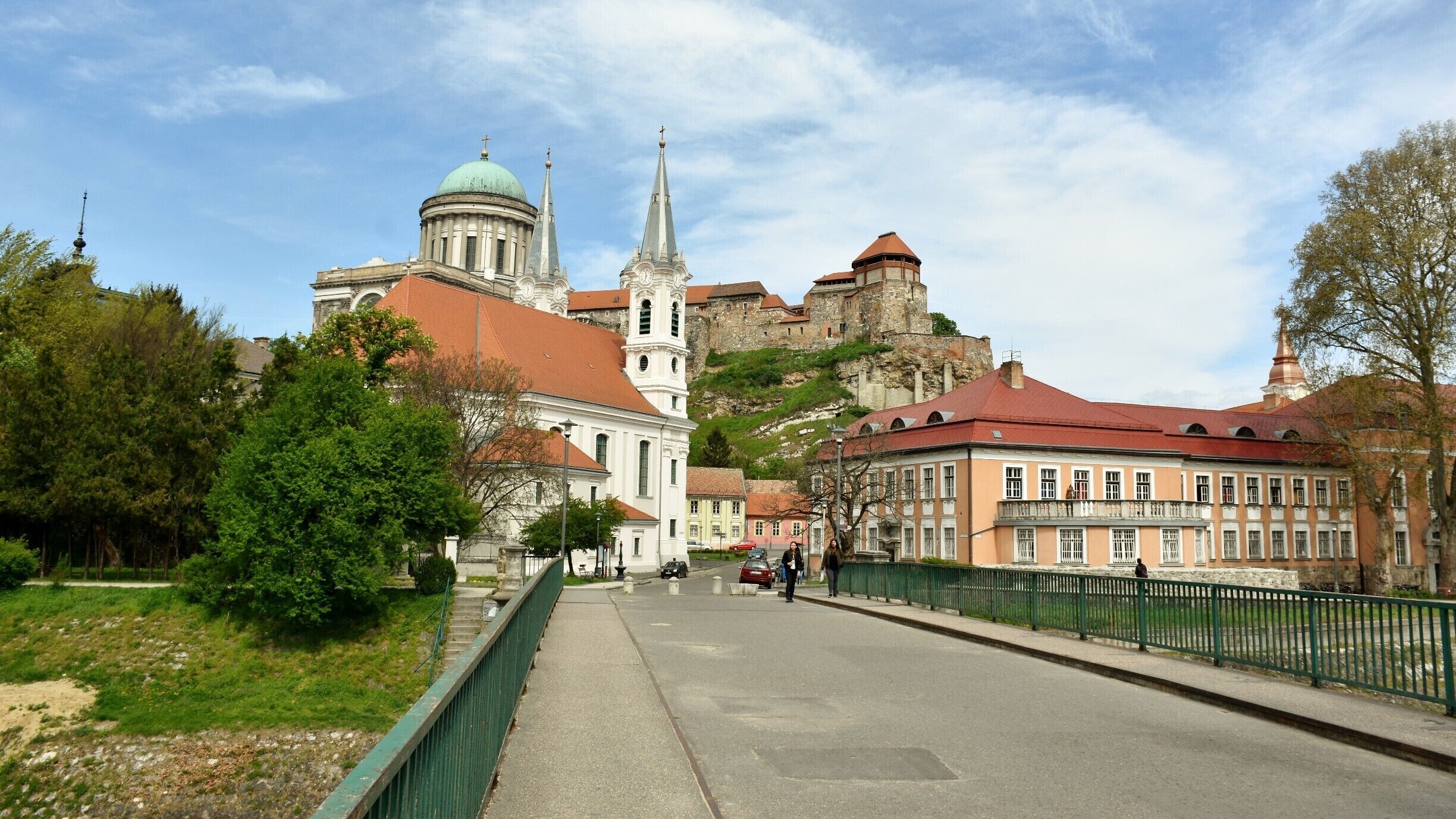 The Primatial Basilica of the Blessed Virgin Mary Assumed Into Heaven and St Adalbert also known as the Esztergom Basilica, is an ecclesiastic basilica in Esztergom, Hungary, the mother church of the Archdiocese of Esztergom-Budapest, and the seat of the Catholic Church in Hungary. It is dedicated to the Saint Mary of the Assumption and Saint Adalbert.

It is the largest church, and the tallest building, in Hungary. Its inner area is 5,600 m². It is 118 m long and 49 m wide. It has a reverberation time of more than 9 seconds. Its dome, forming a semi-sphere, is situated in the middle, and it has 12 windows. It is 71.5 m high inside, with a diameter of 33.5 metres, and is 100 m high from outside, counted from the crypt.

The altarpiece (13.5 × 6.6 metres, depicting the Assumption of the Blessed Virgin Mary, by Girolamo Michelangelo Grigoletti) is the largest painting in the world painted on a single piece of canvas.

The basilica is also known for Bakócz Chapel (named after Tamás Bakócz), built by Italian masters between 1506–1507 out of red marble of Süttő, its walls adorned with Tuscan Renaissance motifs. It is the most precious remaining example of Renaissance art in Hungary.

The huge crypt, built in Old Egyptian style in 1831, is today the resting place of late archbishops, among others, József Mindszenty, famous for his opposition to both Nazi and Communist rule