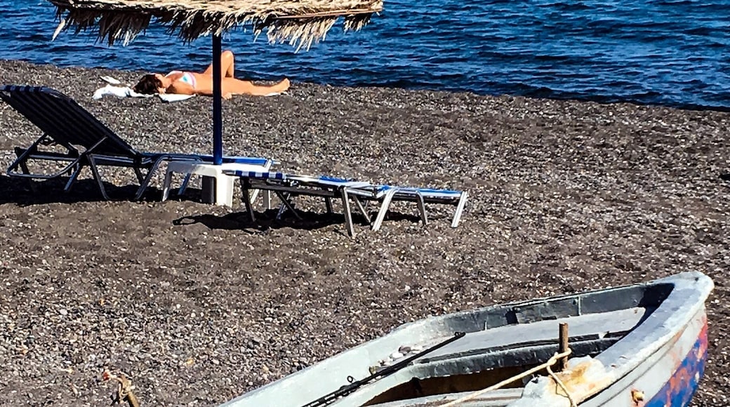 #BVSBlue
Santorini's volcanic history has led to the formation of some of the more unique beaches in the Greek Isles, and Kamari is no exception. Sitting about 4 miles southeast of Fira on the island's east coast, this stretch of black sand is one of the largest in Santorini. The beach is backed by the town of its namesake, a popular resort area where you'll find numerous hotels, restaurants, beachside bars and shops. On the beach, visitors can take advantage of the available lounge chairs and umbrellas.
Travelers enjoyed the clear blue waters of Kamari and suggested planting your feet towards the southern portion of the shore. That's because the views of the imposing Mesa Vouno hill, where you can find Ancient Thira, makes for a picture-perfect Greek beach setting. No matter where you decide to kick back on Kamari Beach, travelers strongly suggest bringing protective footwear. The sand and pebbly terrain can get quite hot with the sun beating down on it, especially after a couple hours, so bring sandals if you're hoping to spend the day on the beach. Some visitors even suggested bringing water shoes, commenting that the underwater terrain at the shore quickly goes from sand to slippery solid rock.