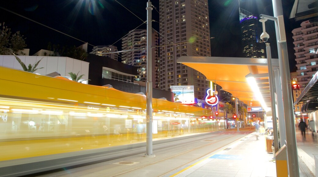 Cavill Avenue featuring railway items and night scenes