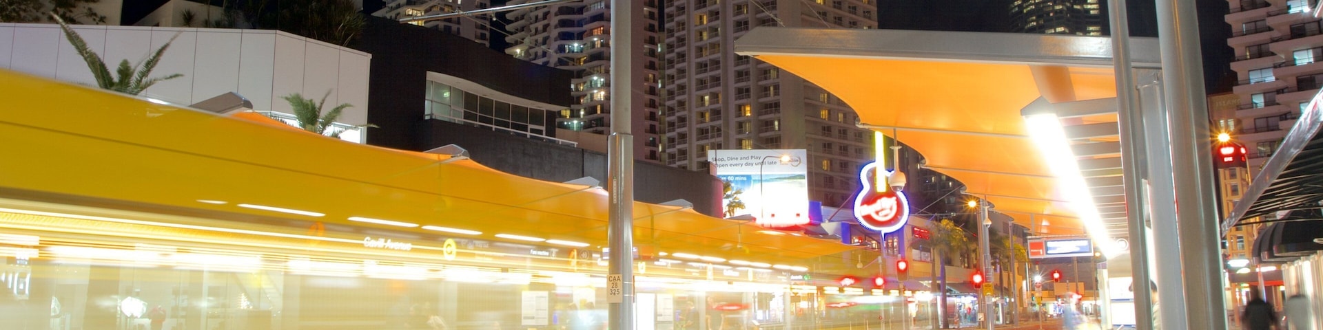 Cavill Avenue featuring railway items and night scenes