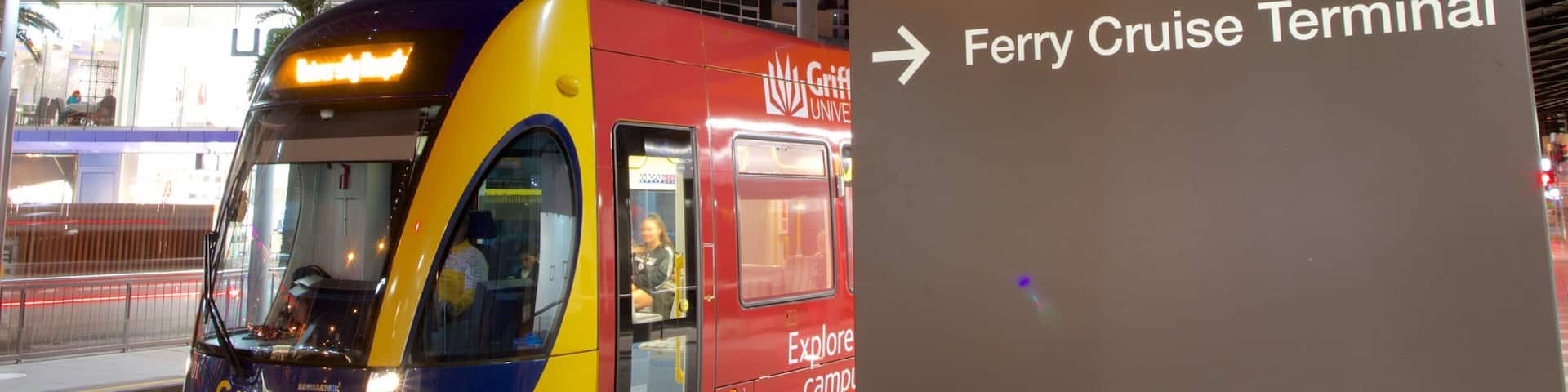 Cavill Avenue showing night scenes, railway items and signage