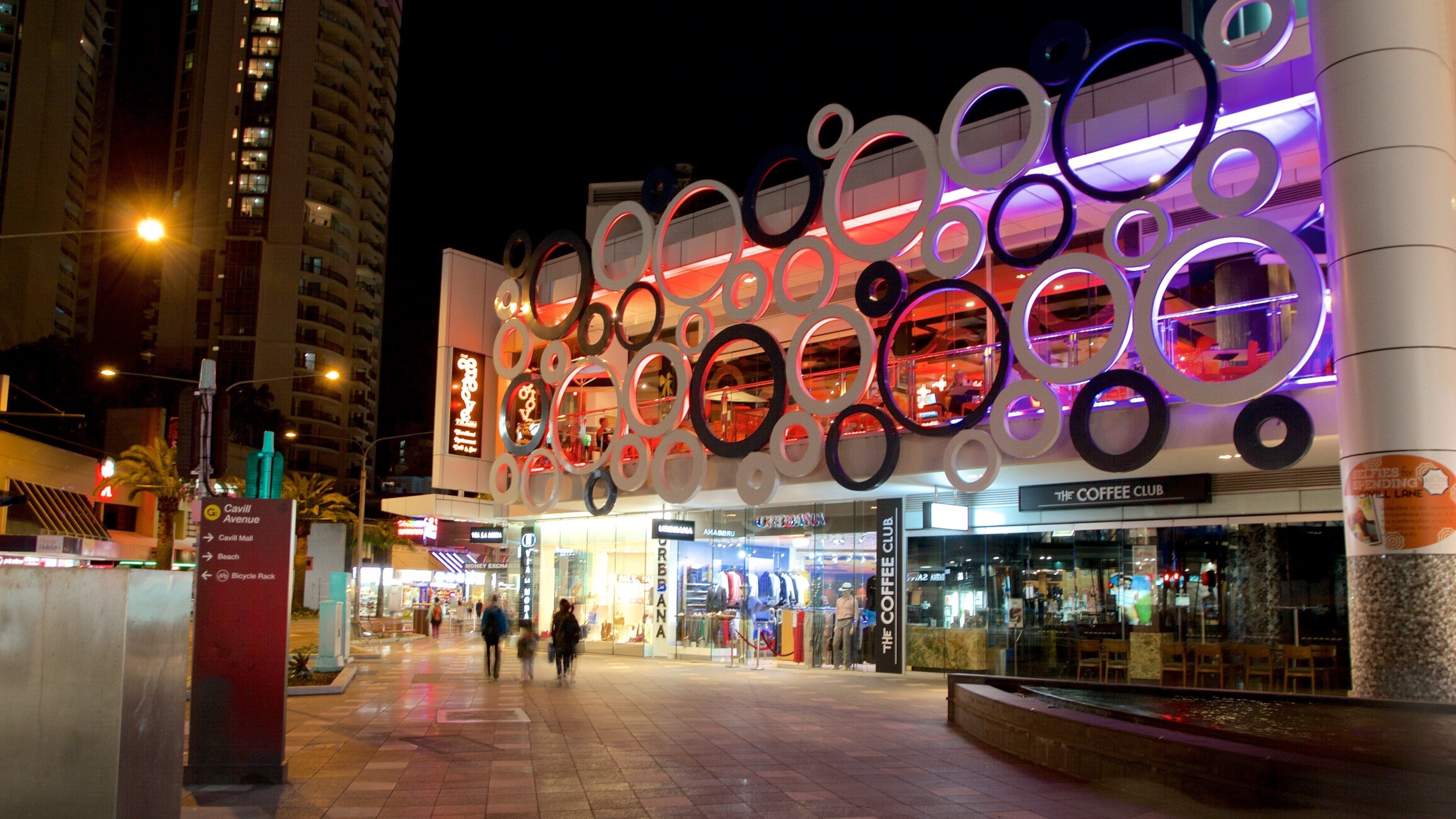 Cavill Avenue featuring night scenes, a city and shopping