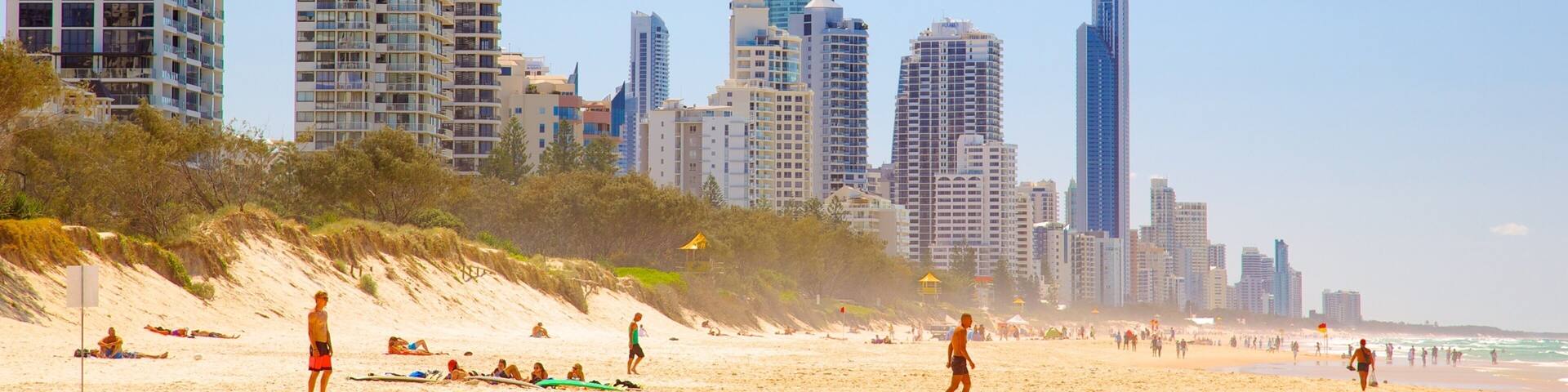 Kurrawa Beach showing a skyscraper, swimming and skyline