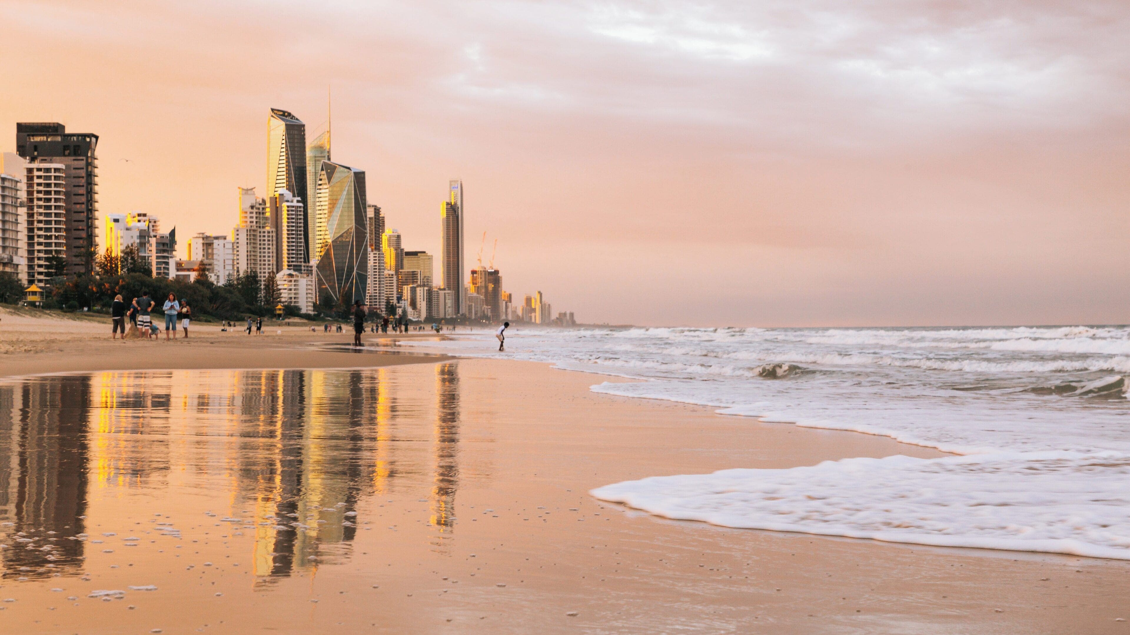 Visit Kurrawa Beach at Broadbeach in Gold Coast Queensland to enjoy stunning sunsets, vibrant city views, and relaxing activities along the shoreline
