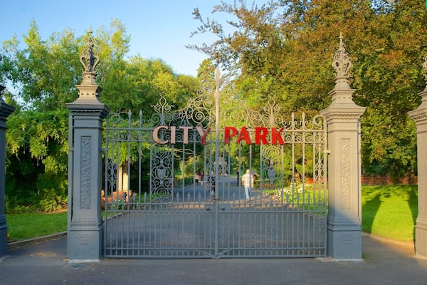 A wrought iron gate with the words "CITY PARK" in red letters.