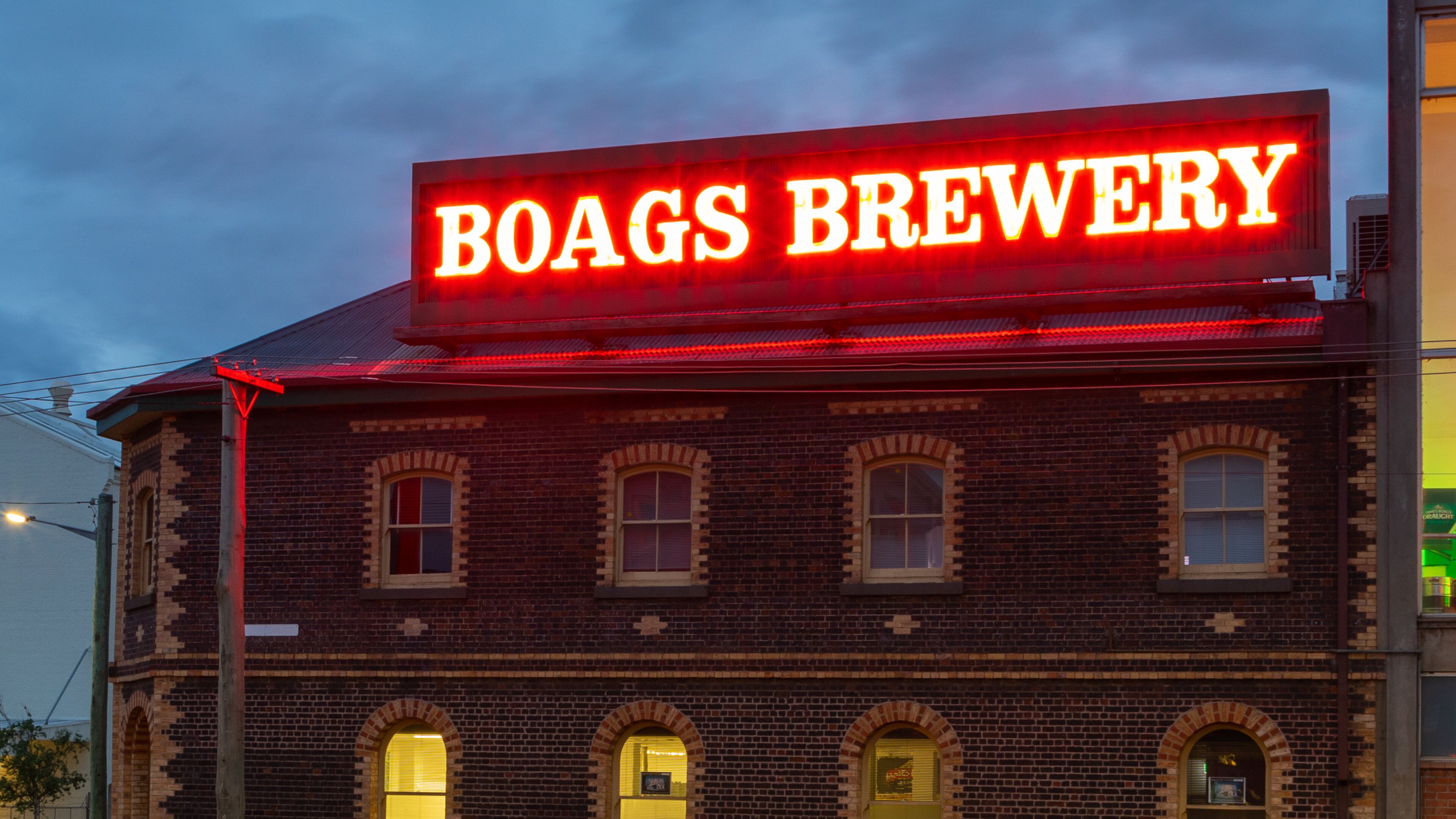 Boags Brewery featuring signage and night scenes