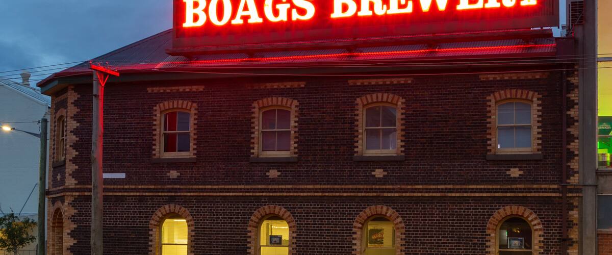 Boags Brewery featuring signage and night scenes