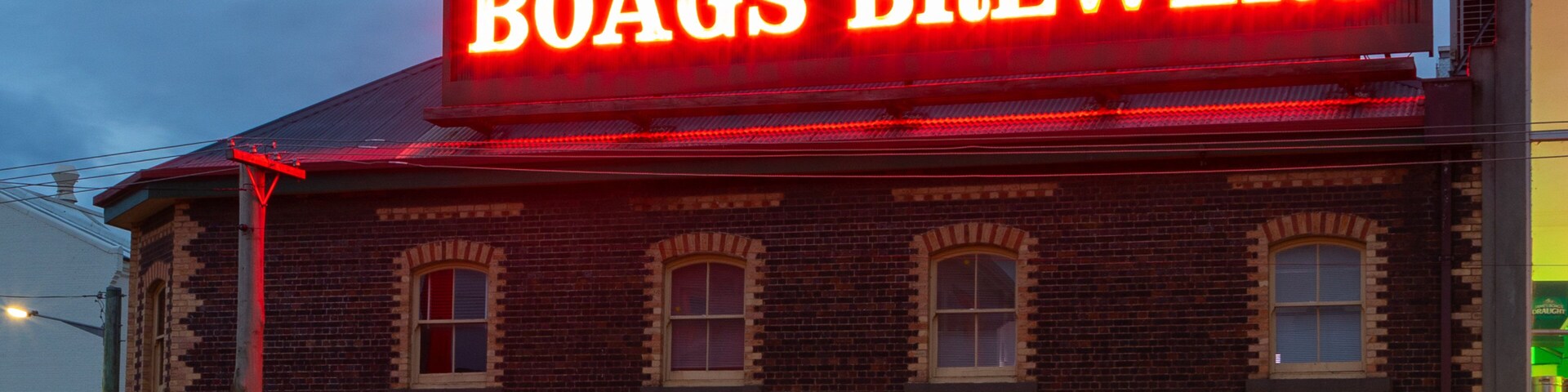 Boags Brewery featuring signage and night scenes