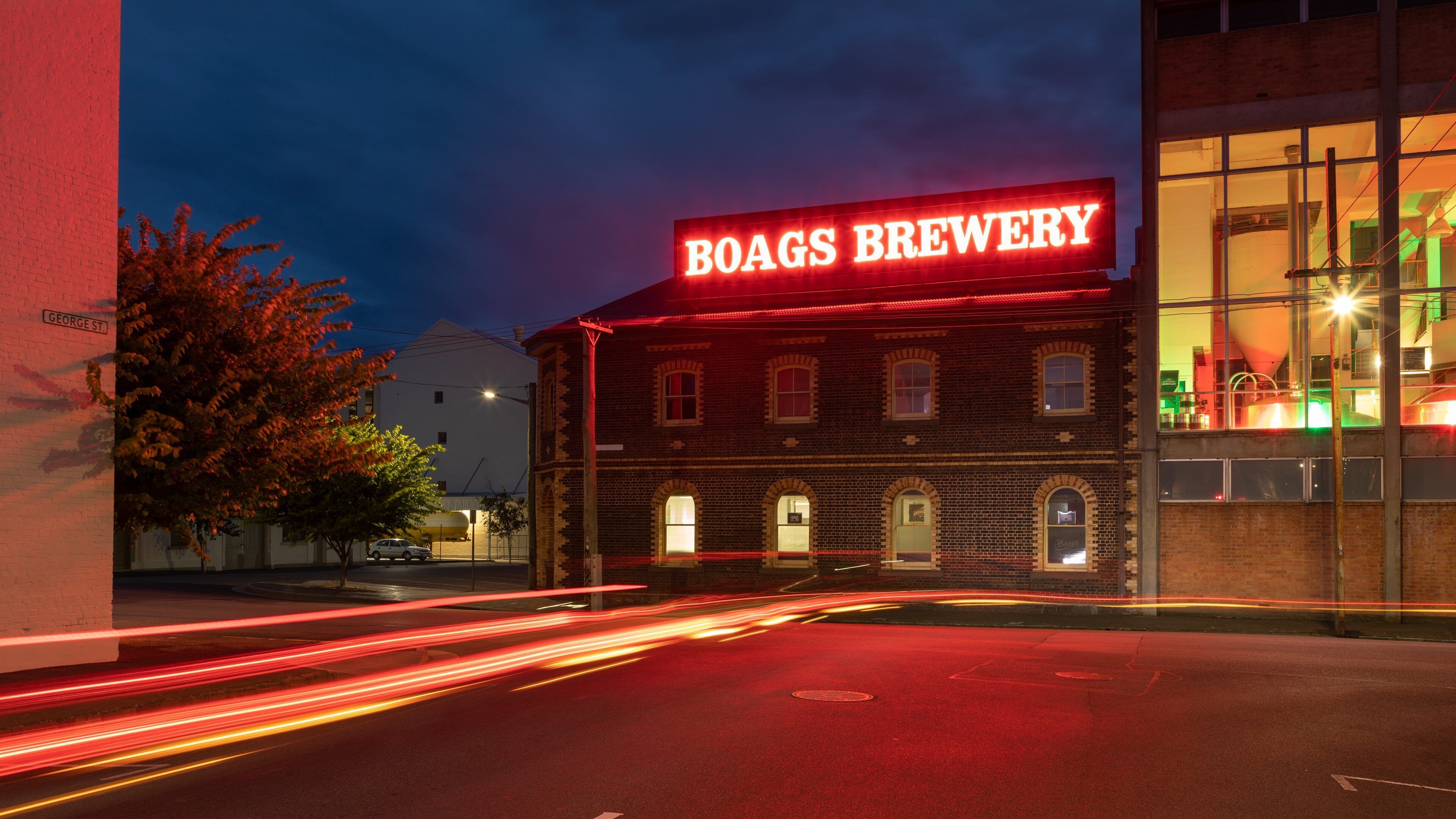 Boags Brewery featuring signage and night scenes