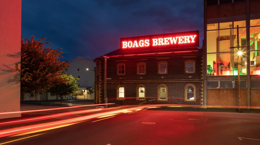 Boags Brewery featuring signage and night scenes