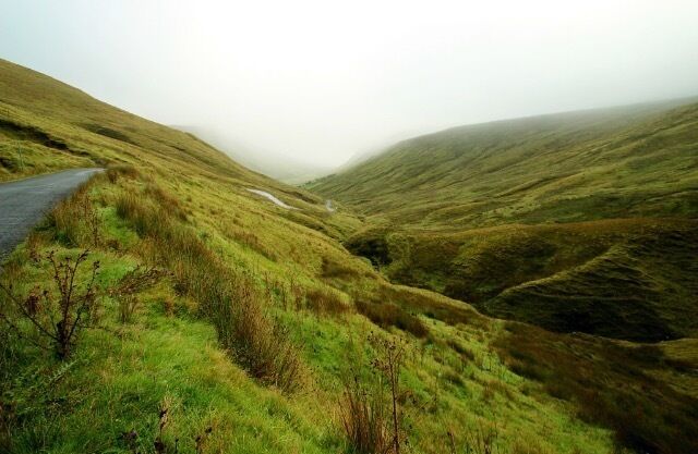 
From Glencolumbkille a road heads inland towards Ardara, through the wild and picturesque Glengesh Pass where the road meanders through sloping mountainous terrain.  Glengesh Pass is a high pass with an elevated window on Loughros Beg Bay, exquisitely framed between the steep sided Glengesh and Mulmosog mountains. 