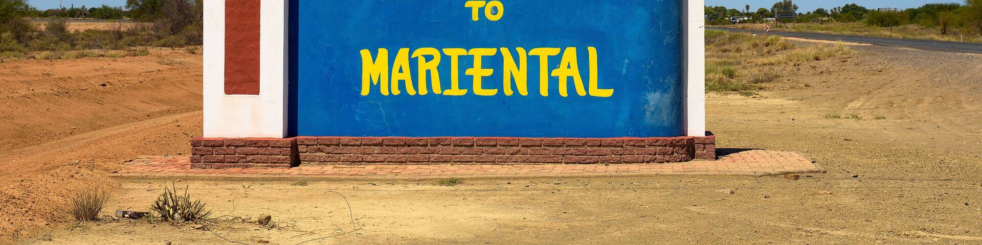A welcome sign for Mariental with a clear blue sky.