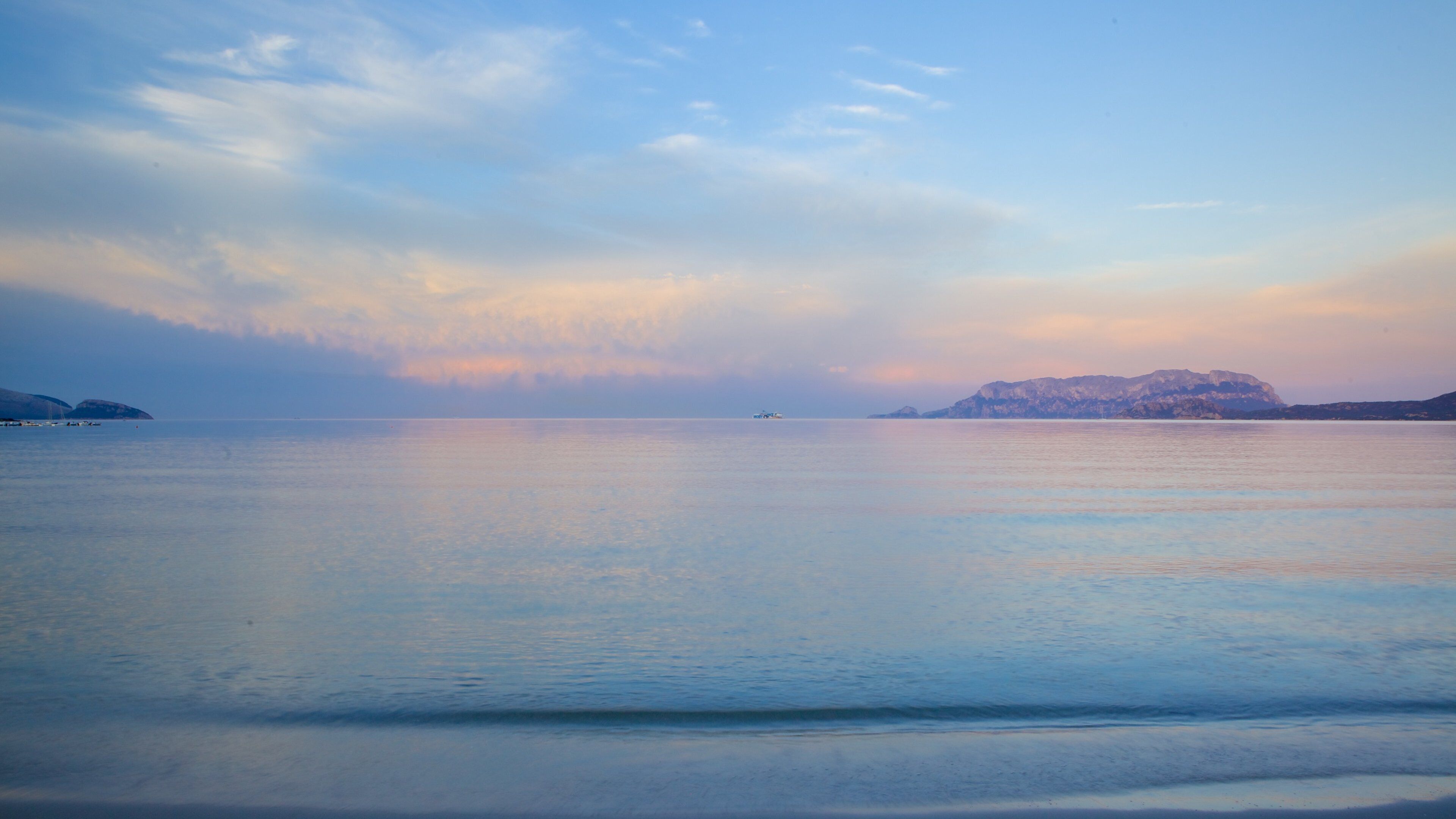 Pittulongu Beach which includes a beach and a sunset