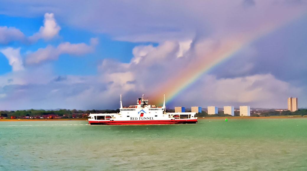 Red Funnel ferry sailing up Southampton water passing Weston Shore and through a rainbow.