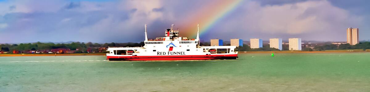 Red Funnel ferry sailing up Southampton water passing Weston Shore and through a rainbow.