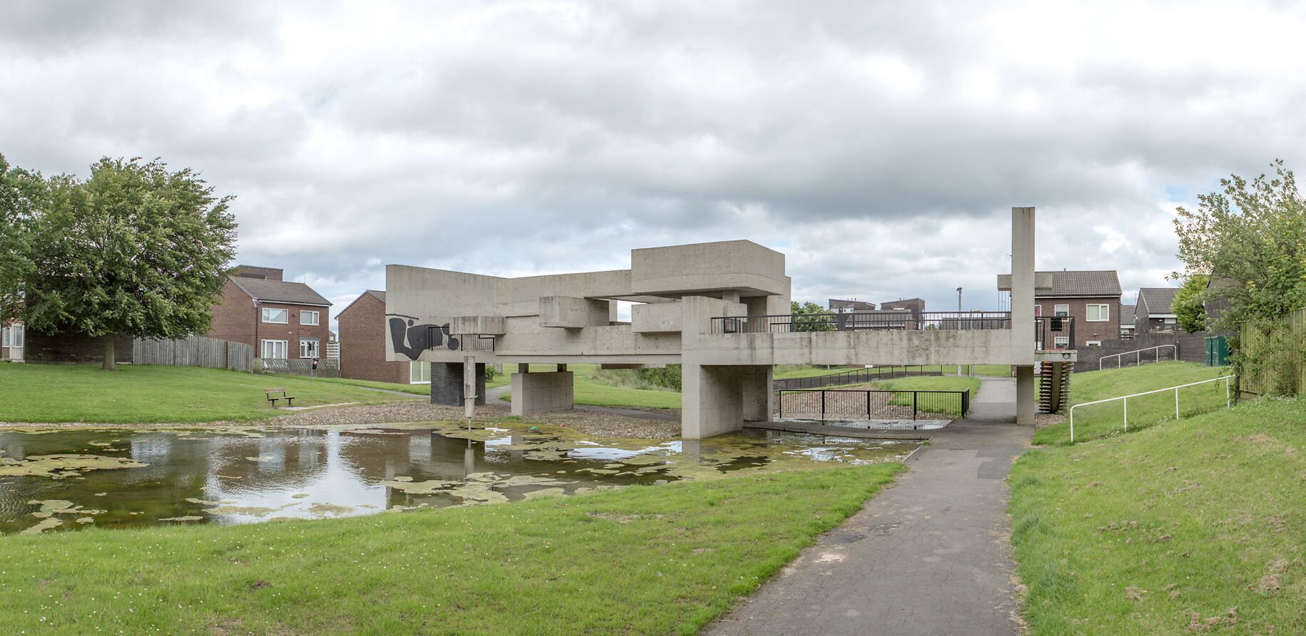 This is a Photo of The Apollo Pavilion, A piece of public art in the new town of Peterlee in County Durham in the North East of England, designed by British artist and architect Victor Pasmore. The sky is overcast and this photo is looking East towards the Structure.