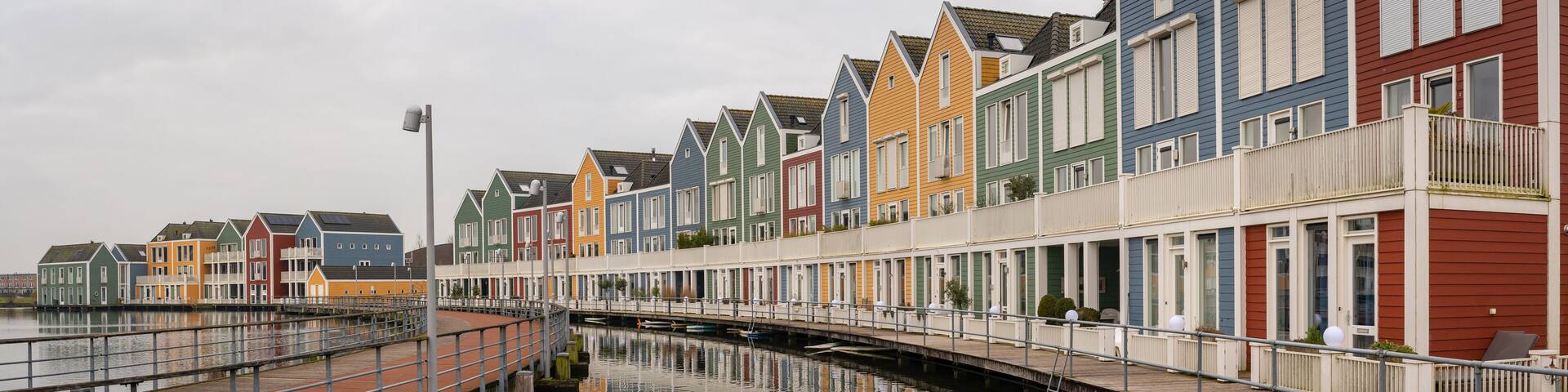 Panorama of famous colorful wooden houses by the Rietplas lake in Houten, Province Utrecht, The Netherlands