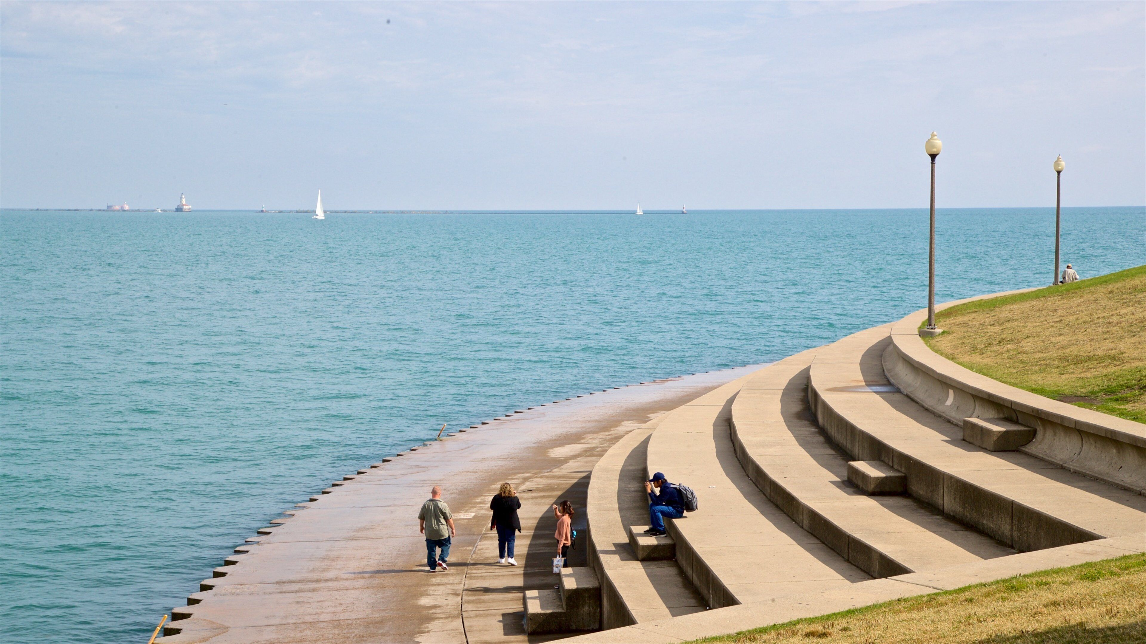 Northerly Island Natural Area which includes general coastal views as well as a small group of people