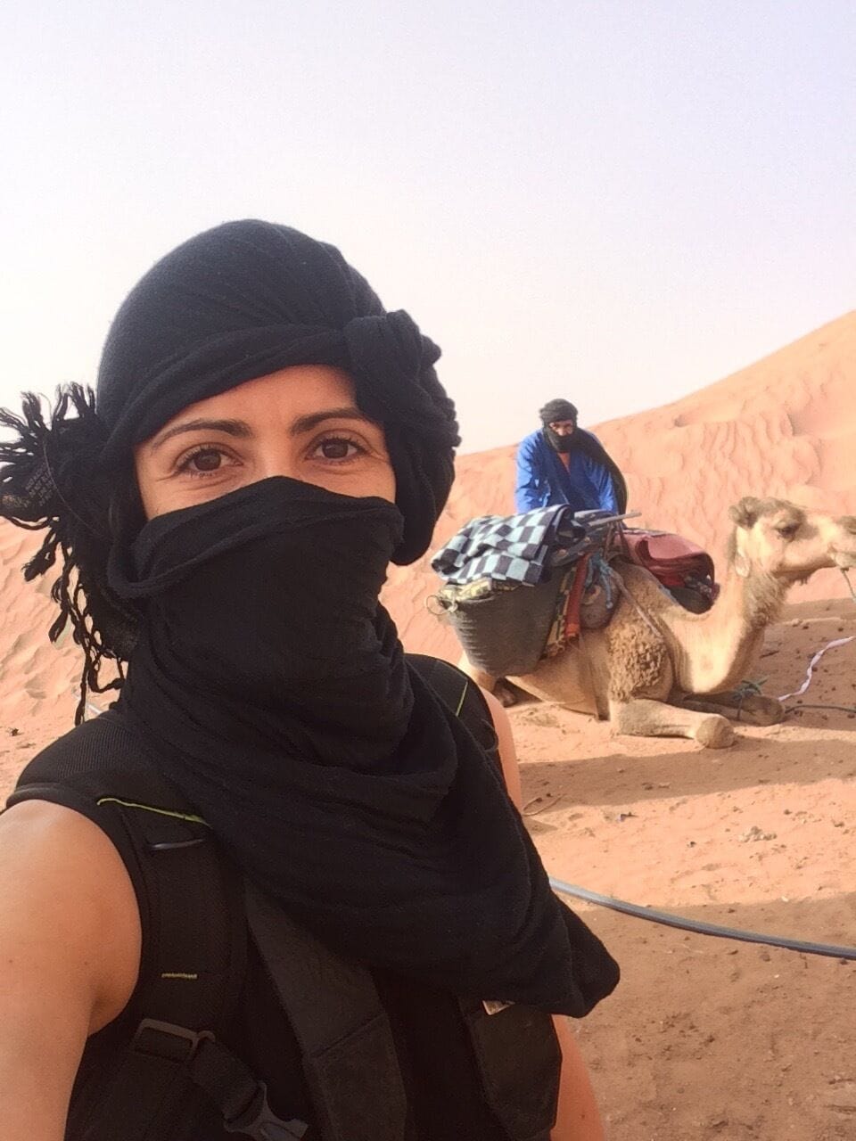 Taking a desert camel ride and camping overnight in the Sahara