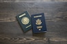 Mexican and American passports. Two passports with dark wooden background.