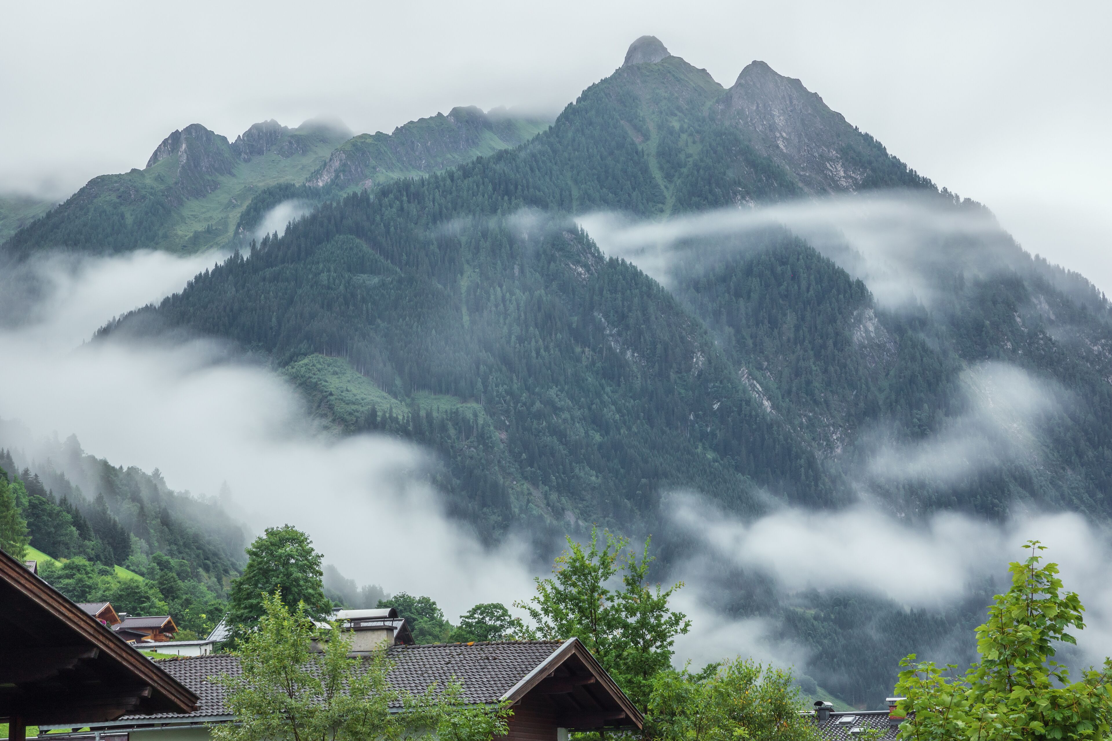Low early morning clouds floating in the valleys of the mountains around Fusch an der Grossglocknerstrasse
