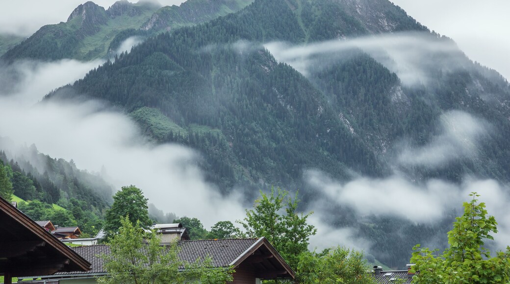Low early morning clouds floating in the valleys of the mountains around Fusch an der Grossglocknerstrasse