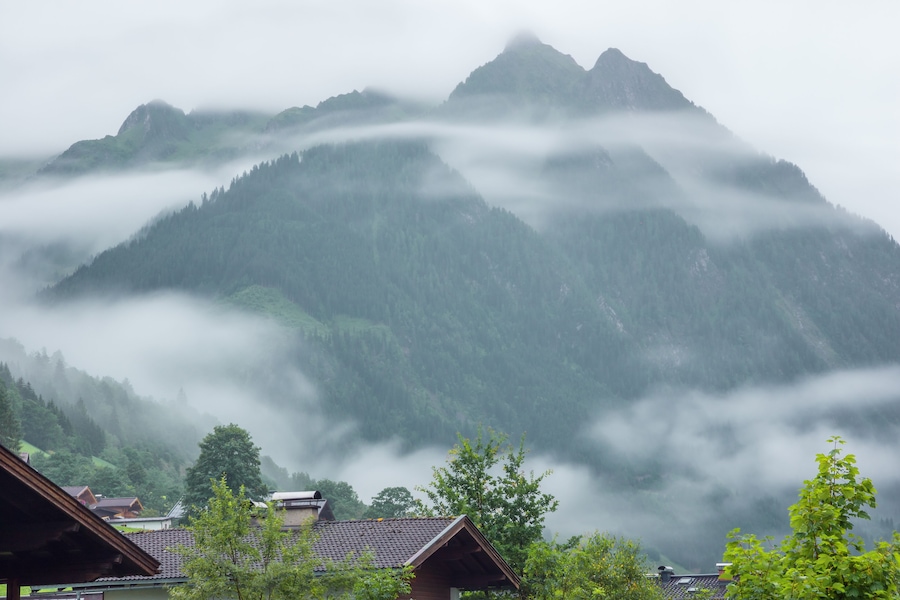 Low morning clouds and haze floating in the valleys of the mountains around Fusch an der Grossglocknerstrasse