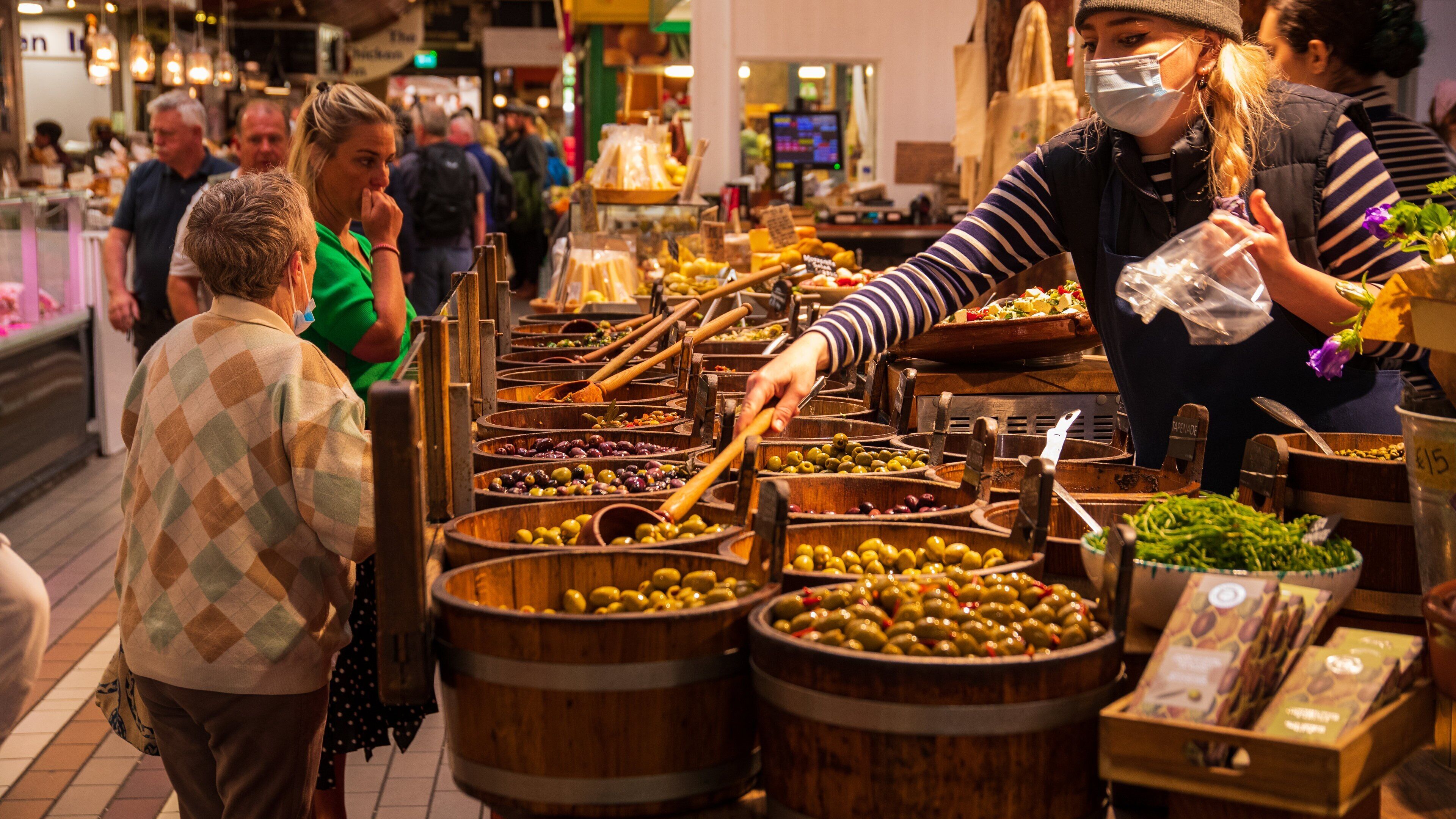 English Market featuring food and markets as well as a small group of people