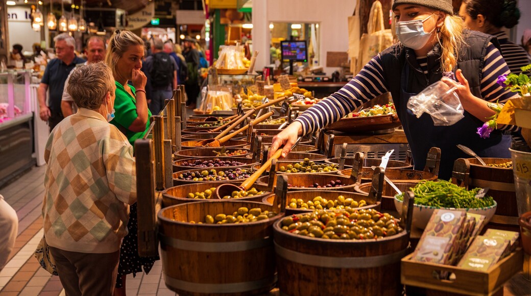 English Market featuring food and markets as well as a small group of people