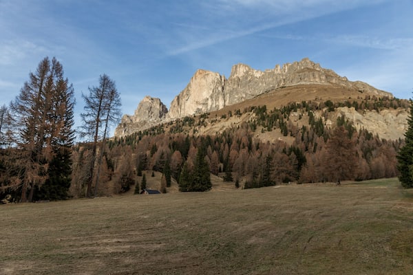 Beautiful view of Pale di San Martino in the italian Dolomites with blue cloudy sky. Fiera di Primiero