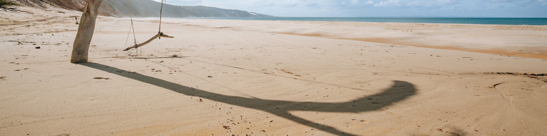 Rainbow Beach which includes general coastal views and a beach