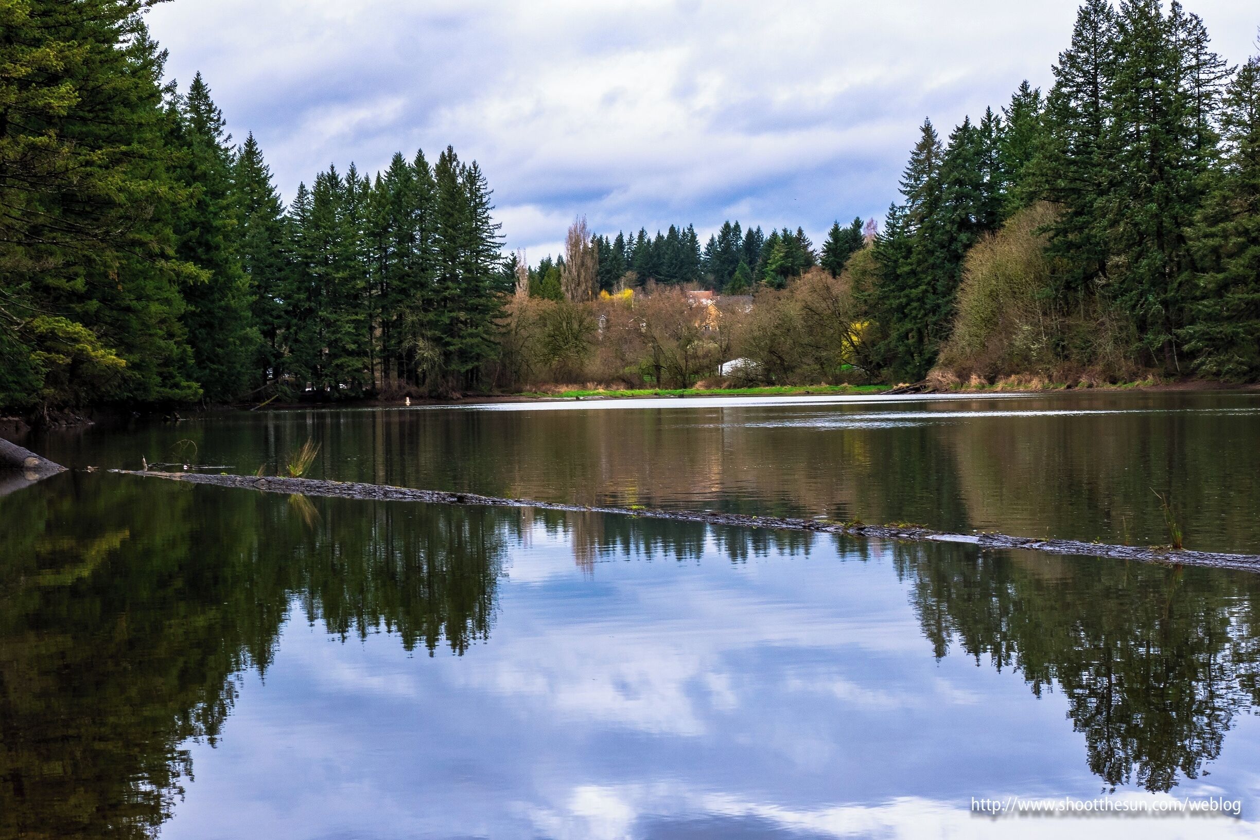 The lake itself is essentially a reservoir, built behind a dam constructed in the late 19th century to power the local pulp mill.  The dam is just a beautiful antique now, and the reservoir "reserves" the water for little more than recreation.