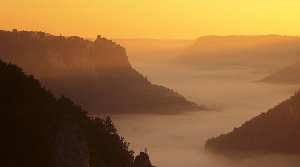 View from Eichfelsen Rock on Schloss Werenwag Castle and Danube Valley at sunrise, Upper Danube Nature Park, Swabian Alb, Baden Wurttemberg, Germany