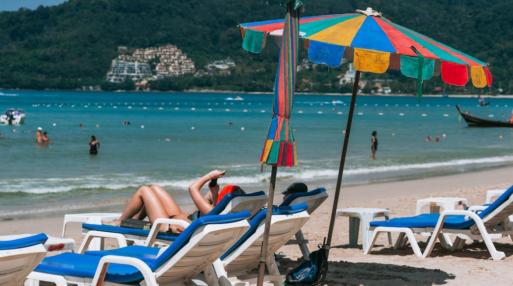 Patong Beach which includes general coastal views and a beach as well as a couple