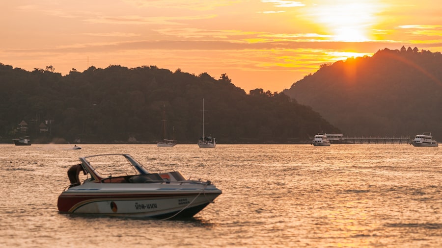 Patong Beach featuring general coastal views, a sunset and boating