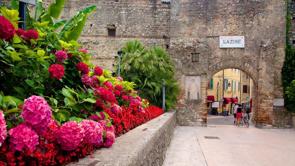 A historic stone building with a sign reading "LAZISE".