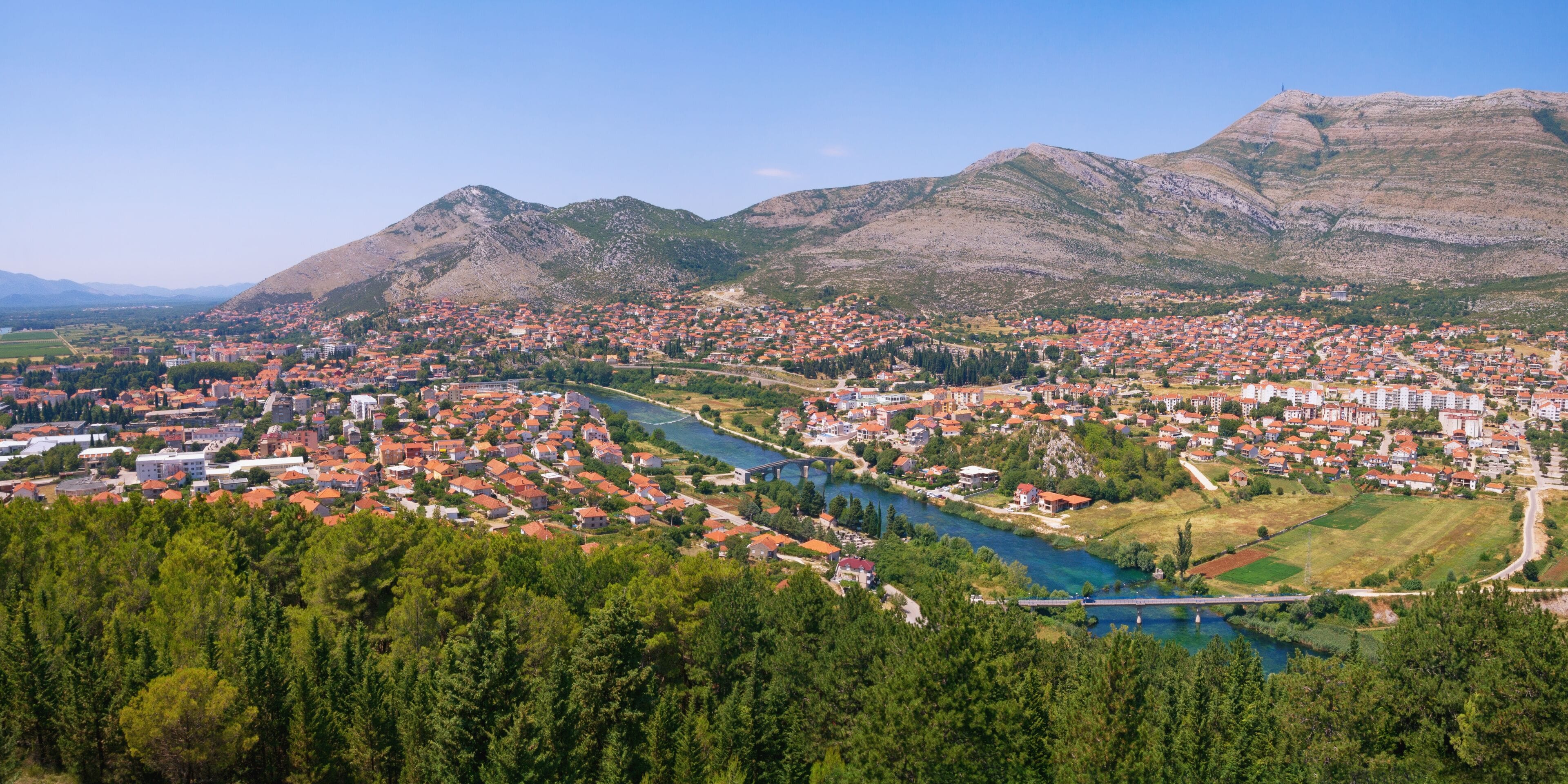 Panoramic view of Trebinje city and Trebisnjica river from Crkvina Hill on sunny summer day. Bosnia and Herzegovina, Republika Srpska