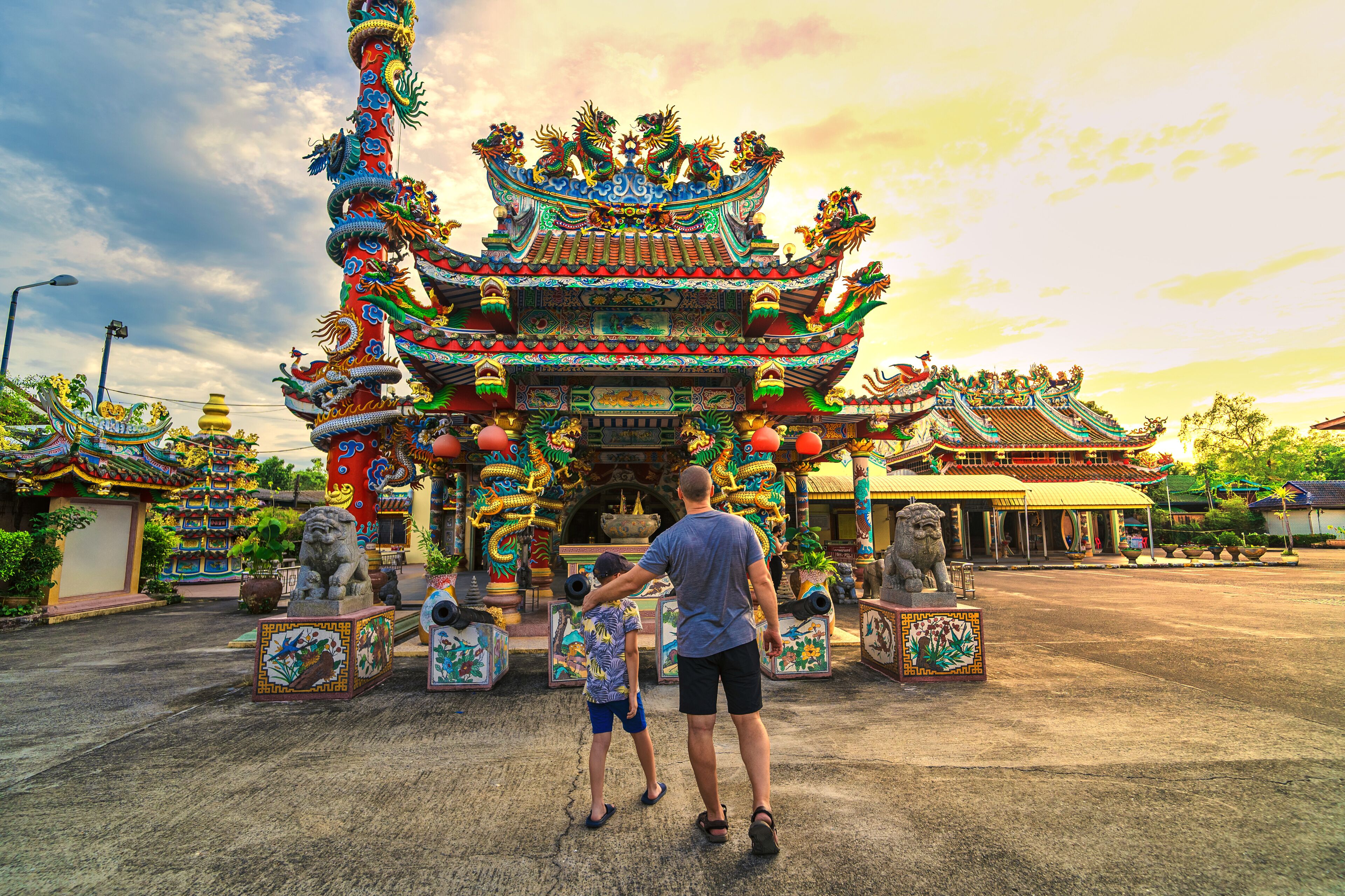 A traditional ornate temple with intricate architecture and lion statues.