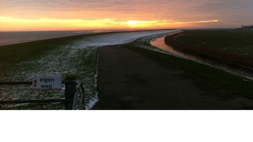 Sunset on the winterish island of Ameland, one of the 5 Waddeneilanden.