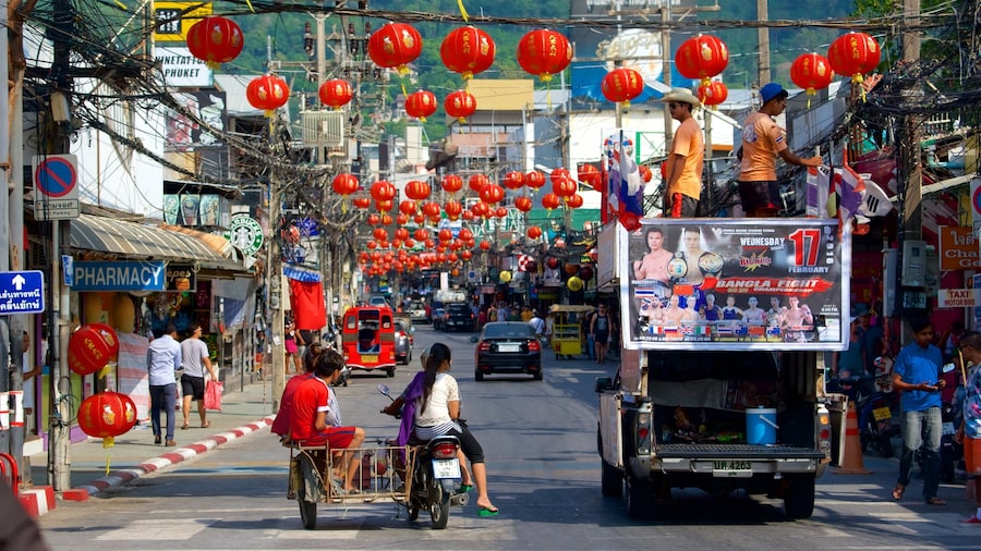 Bangla Night Street which includes signage as well as a small group of people