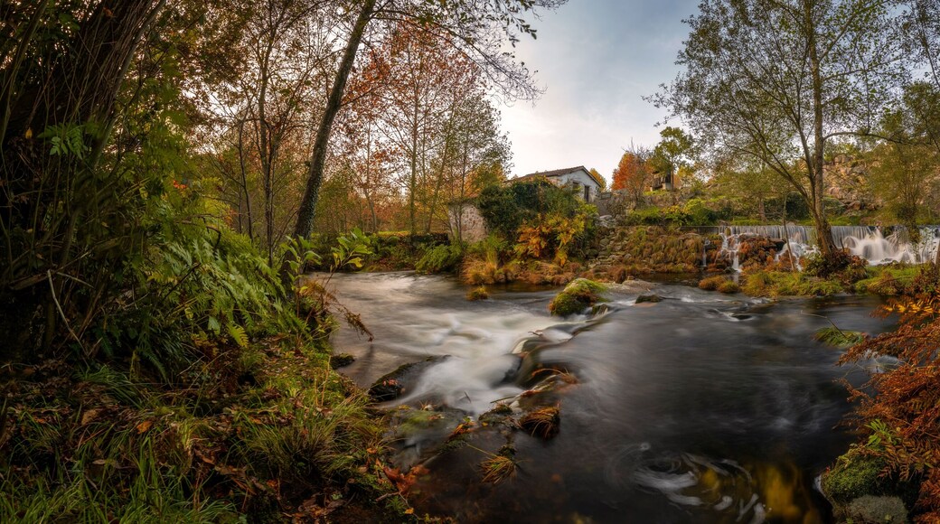 Mondim de Basto panorama waterfall with a mill house at sunset in Portugal