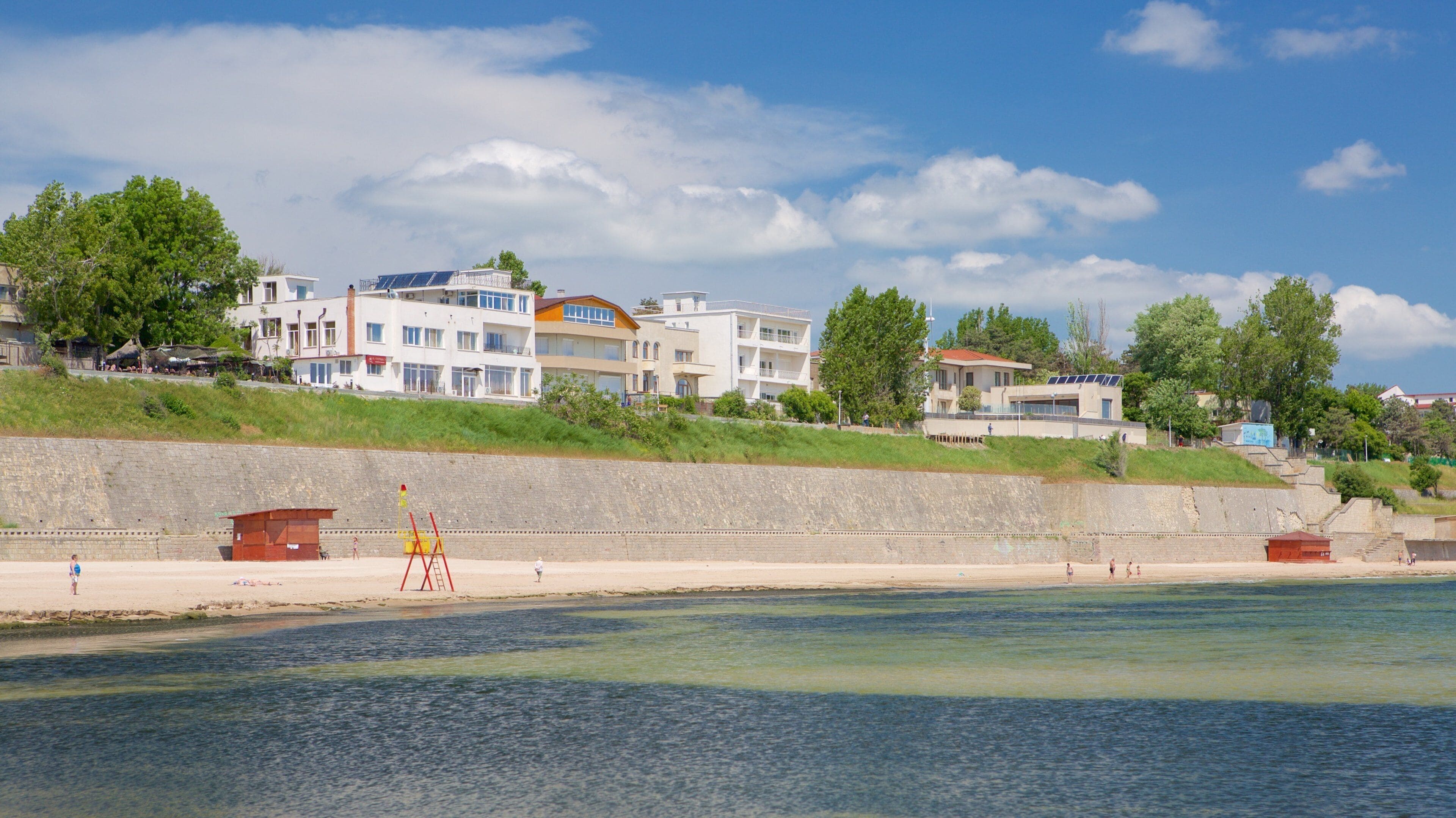 Eforie which includes a coastal town and a sandy beach