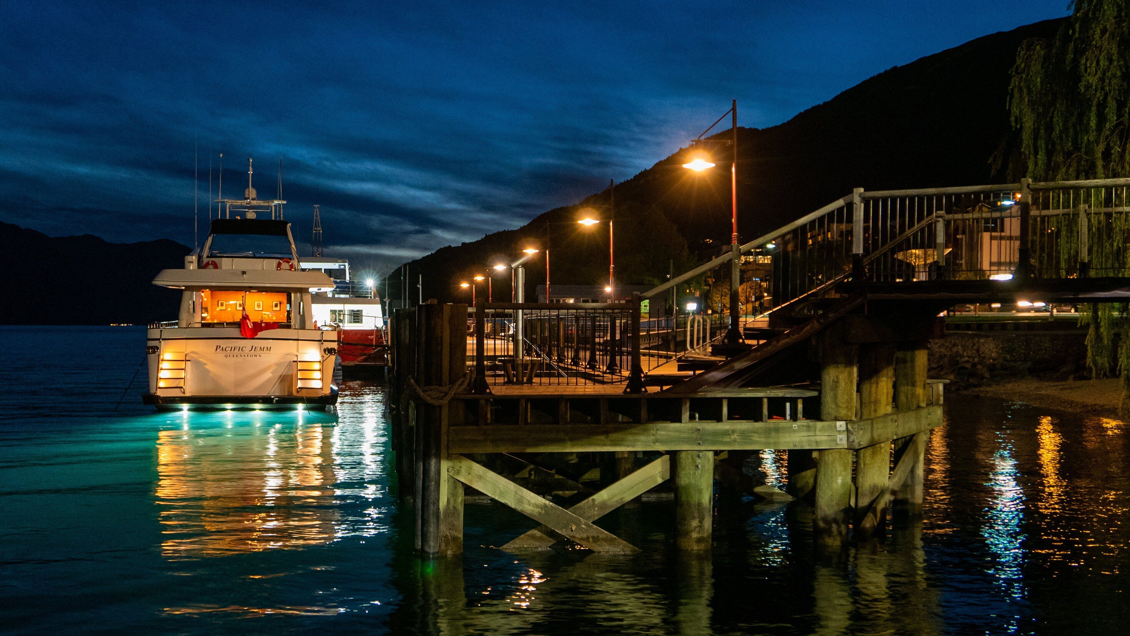 Steamer Wharf featuring a bay or harbor and night scenes