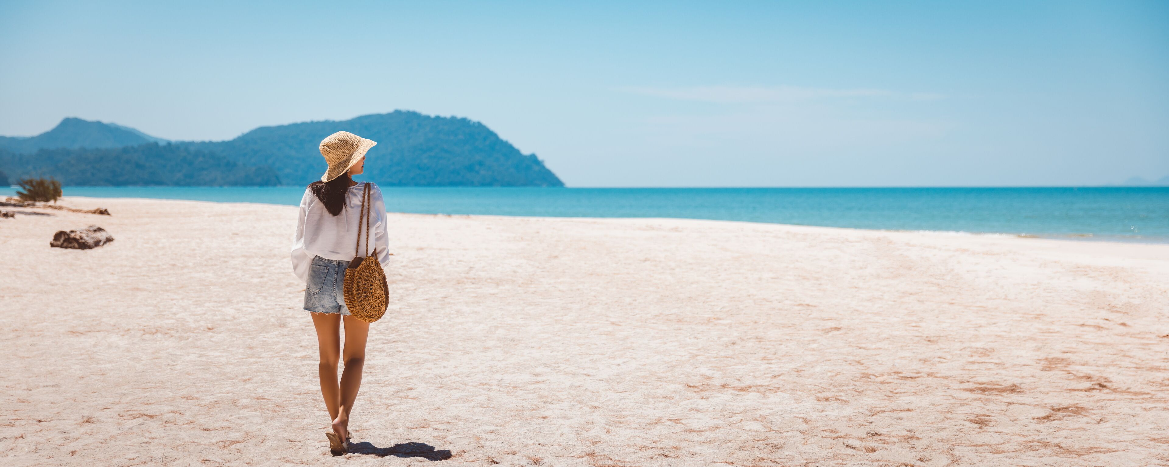 Traveler asian woman relax and travel on beach in Thailand