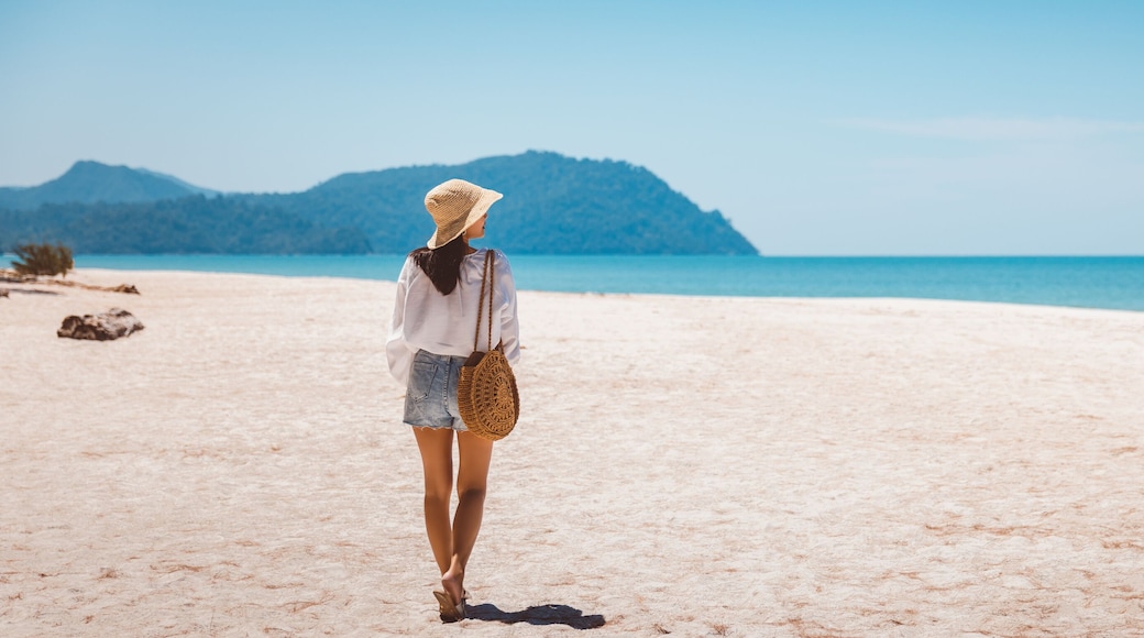 Traveler asian woman relax and travel on beach in Thailand