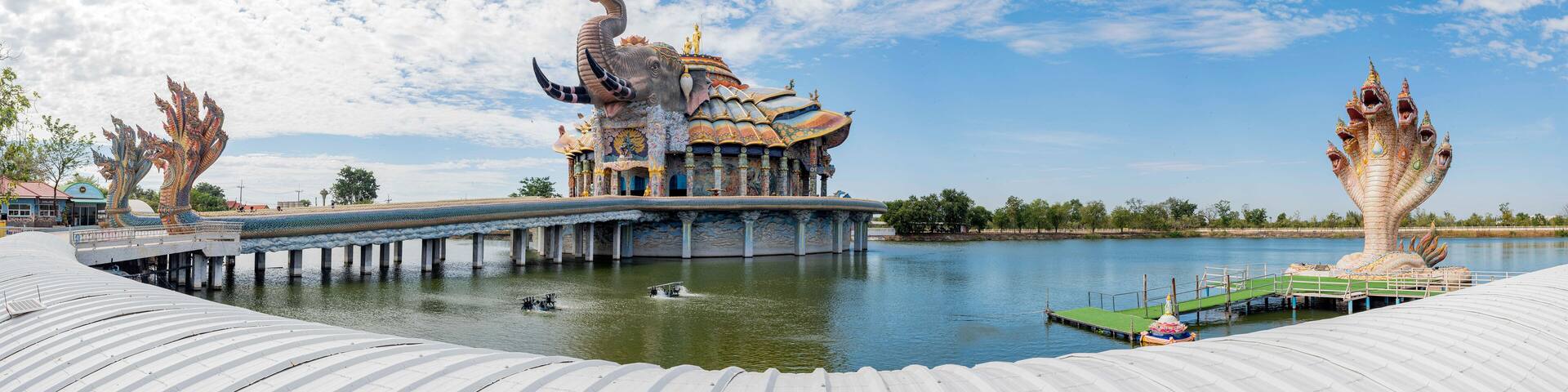 Wat Ban Rai, in Nakhon Ratchasima, is famous for the revered monk Luang Pho Koon. Its ornate architecture, especially the mosaic-covered Ubosot and Thep Wittayakom Hall, draws many visitors.